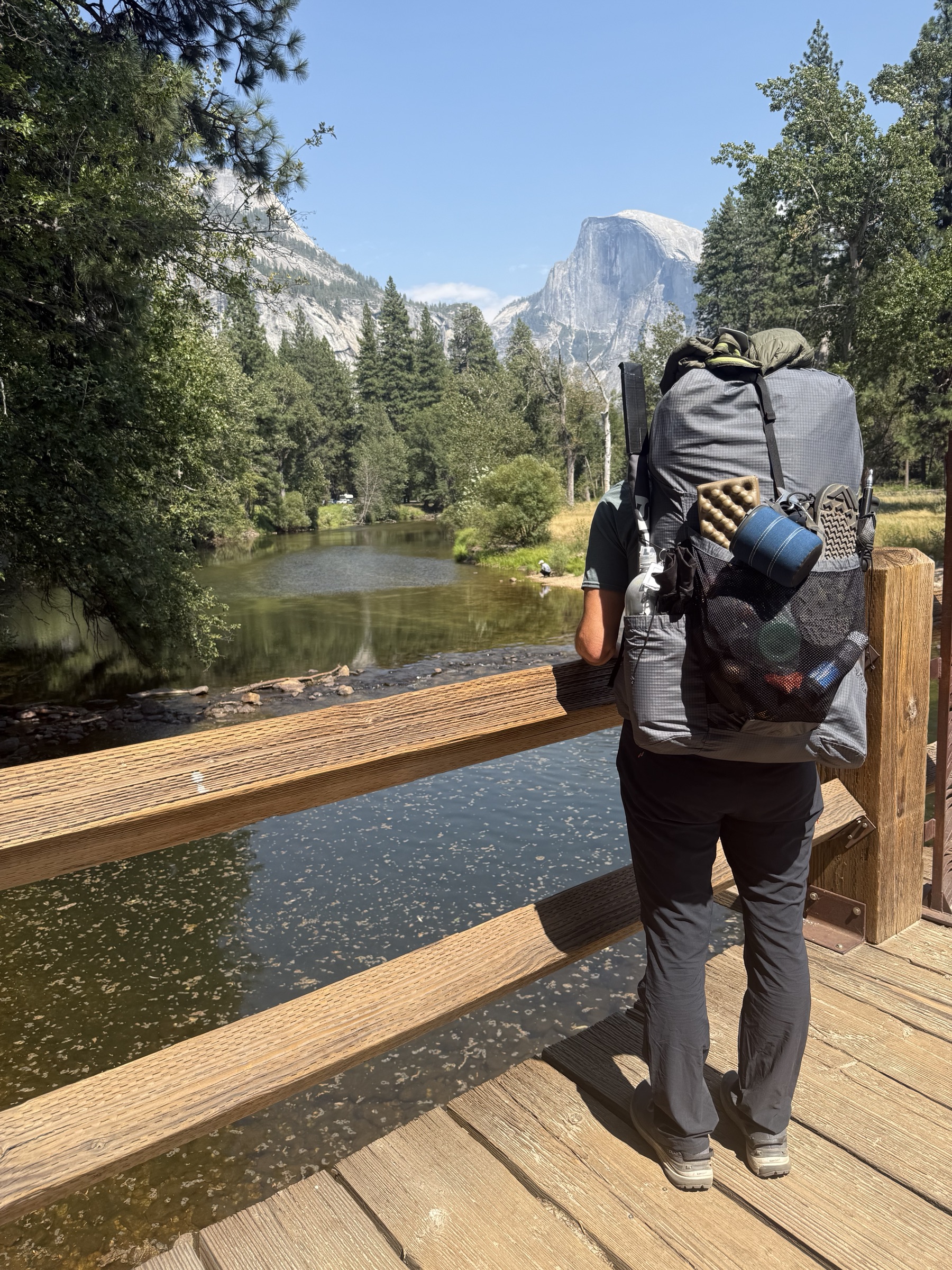 Kevin wearing his loaded backpack on a bridge in Yosemite Valley