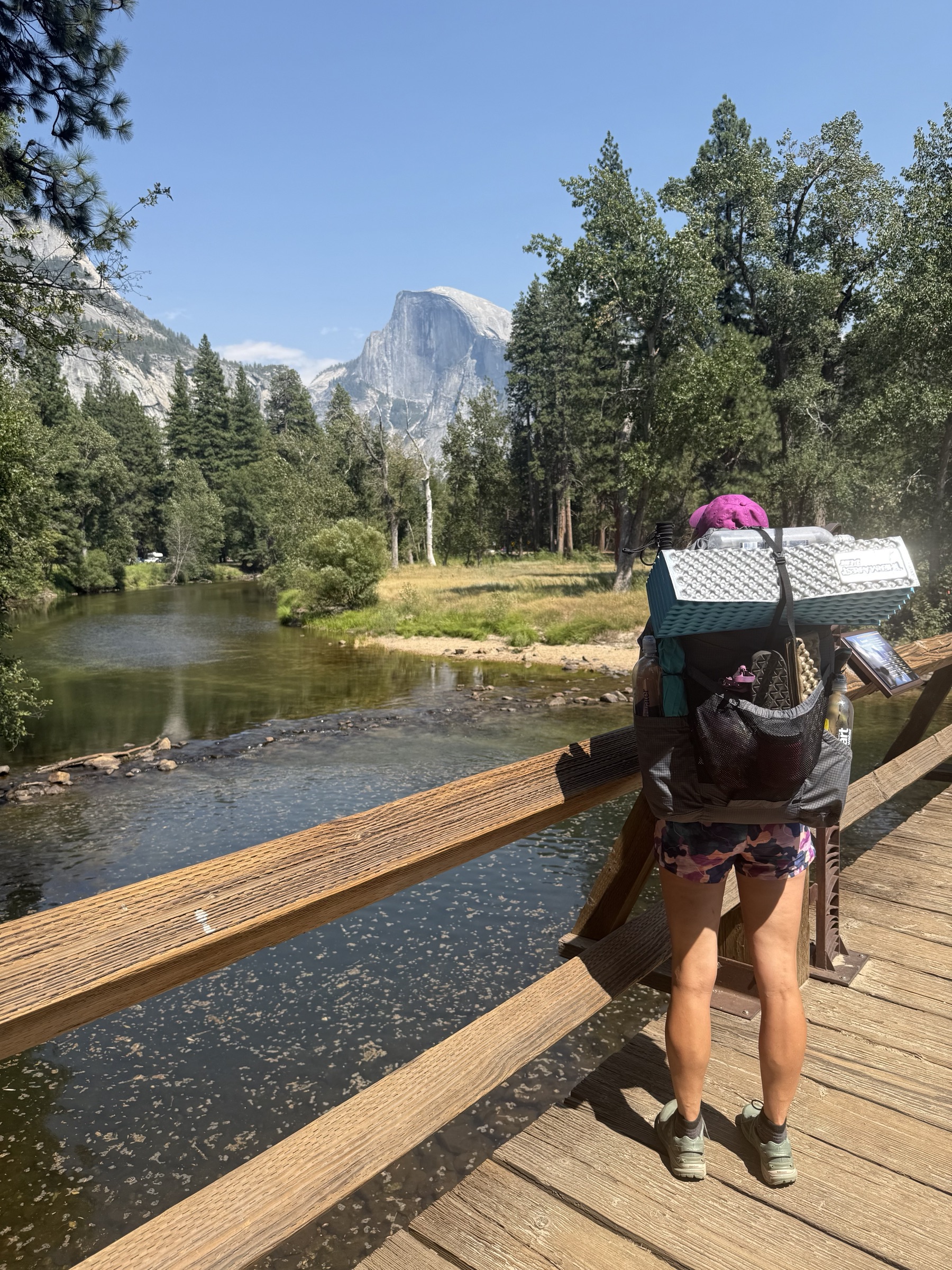Lynlee wearing her loaded backpack on a bridge in Yosemite Valley